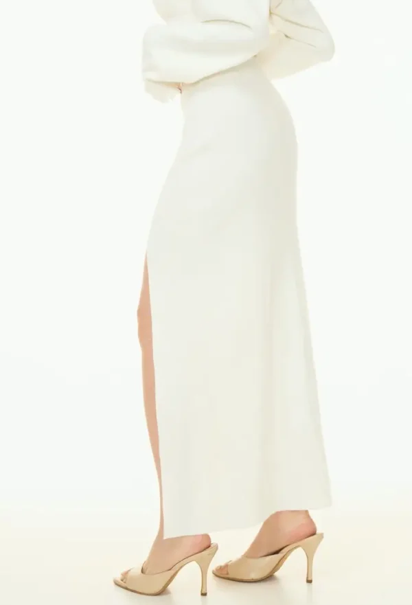 Side view of white Good Days Knit Skirts displaying elegant silhouette with side slit detail and maxi length